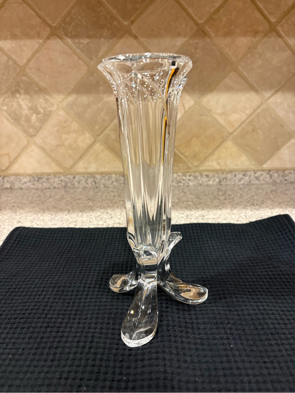 Vintage lead crystal bud vase with a fluted, tulip-shaped body